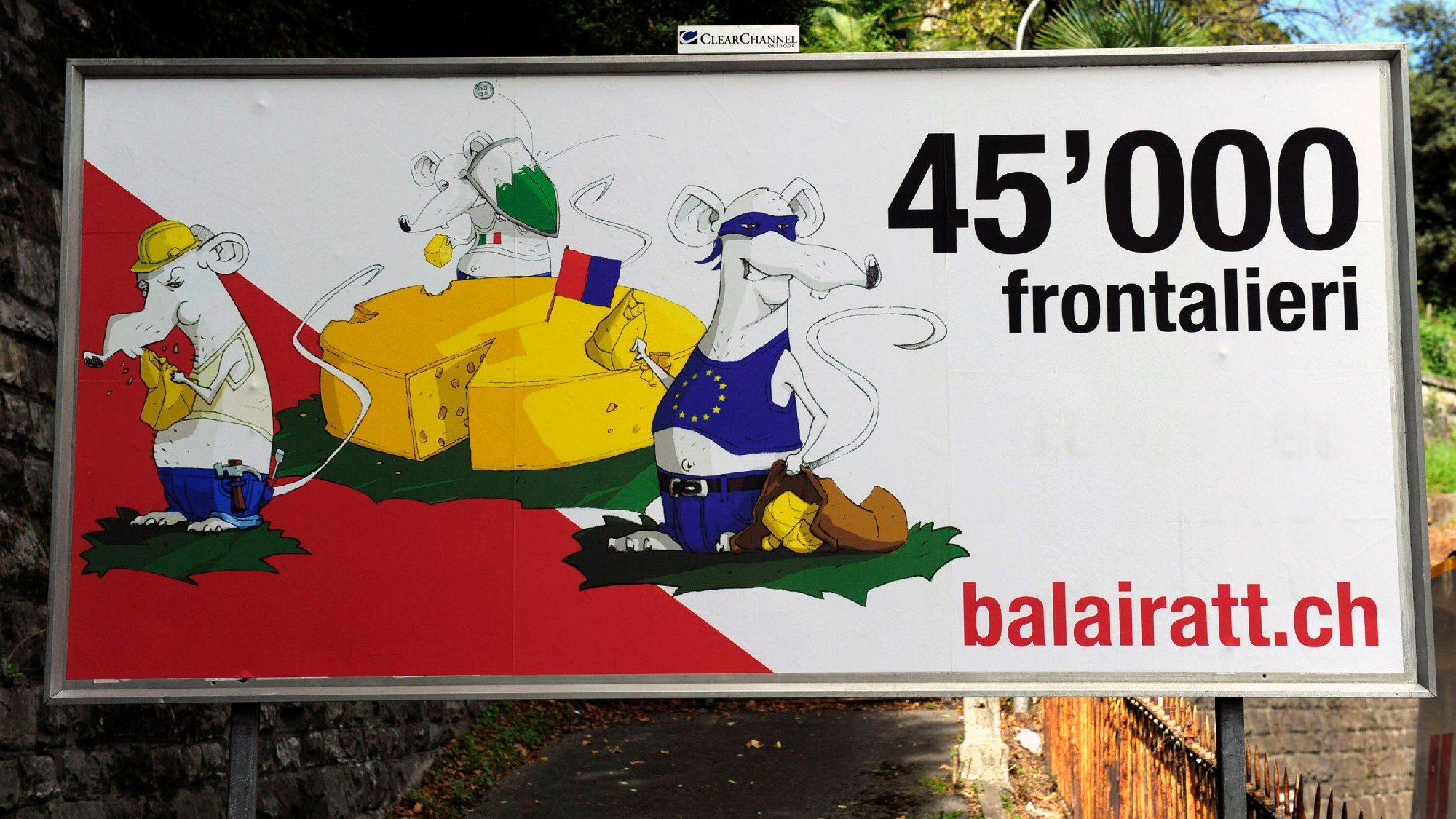 A billboard erected by the far-right Swiss People's Party in 2012 depicting Italian migrant workers and Roma as rats eating Swiss cheese 