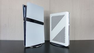 The Minisforum G1 Pro next to a PS5 Pro on a table