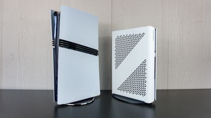 The Minisforum G1 Pro next to a PS5 Pro on a table