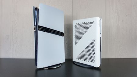 The Minisforum G1 Pro next to a PS5 Pro on a table