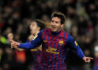 Lionel Messi celebrates after scoring for Barcelona against Osasuna in the Copa del Rey in January 2012.