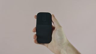 Man holding up the Logitech Mobi Fold