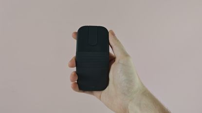 Man holding up the Logitech Mobi Fold