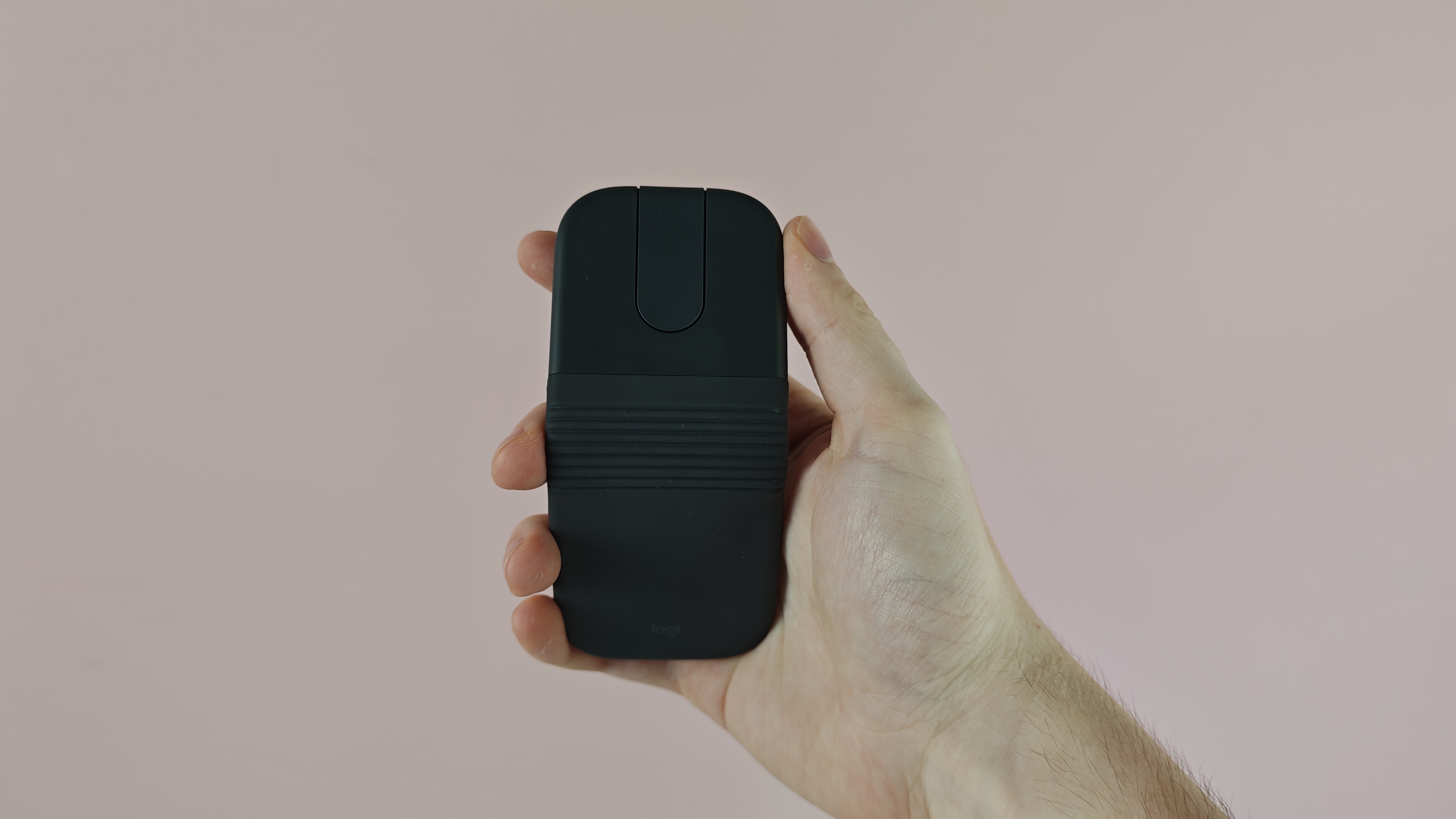 Man holding up the Logitech Mobi Fold