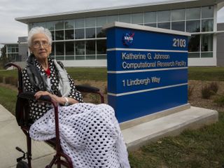 Mathematician Katherine Johnson poses for a photo with her namesake, the Katherine G. Johnson Computational Research Facility at NASA’s Langley Research Center in Virginia, during a ribbon cutting ceremony on Sept. 22, 2017. Johnson’s story as one of NASA’s “human computers” who calculated trajectories for early crewed spaceflights is told in the book and film "Hidden Figures."