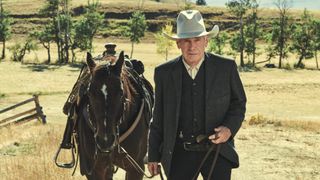 Harrison Ford as Jacob Dutton stands with a horse on 1923 Yellowstone prequel
