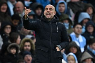 Manchester City manager Pep Guardiola gives instructions during a game against Bournemouth in November 2023.