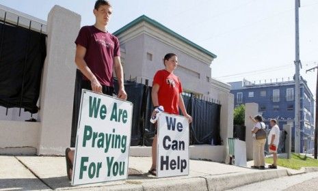 Anti-abortion activists protest outside Mississippi&amp;#039;s only abortion clinic, which was narrowly saved by a federal judge until July 11 when the court will convene to decide the clinic&amp;#039;s fate.