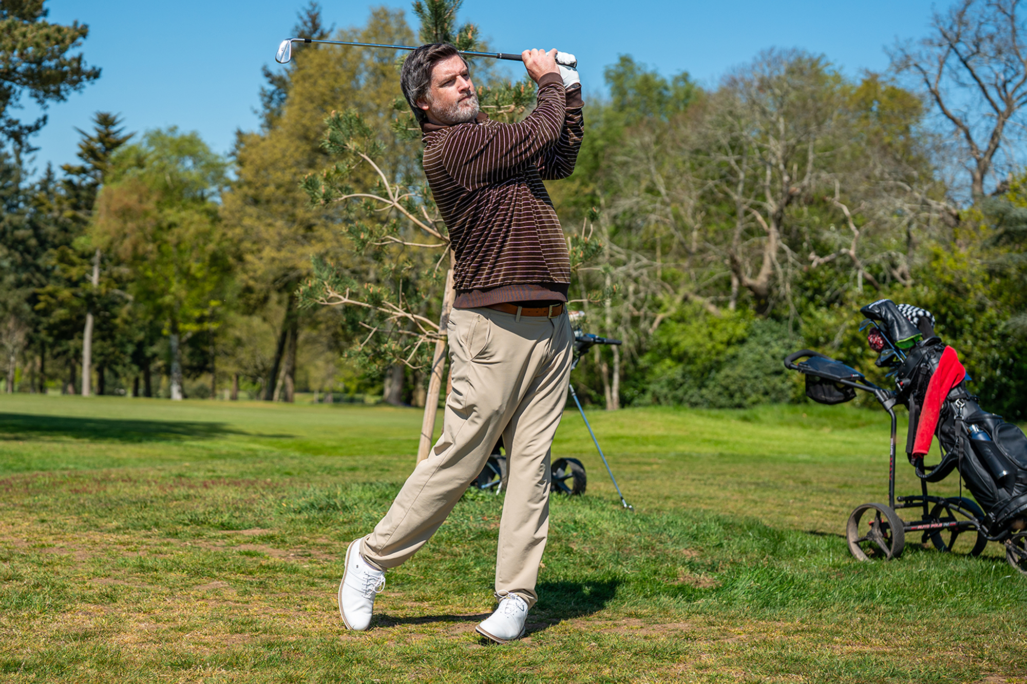 Joe Ferguson in the finish position after hitting an iron shot