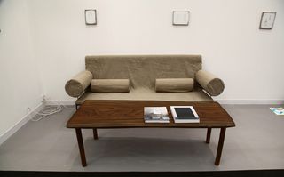 Brown sofa next to a wooden coffee table