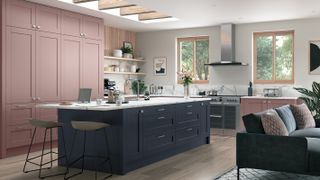blue shaker kitchen island with pink kitchen units