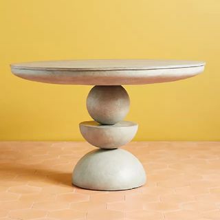 A concrete sculptural dining table