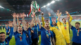 Leonardo Bonucci lifts up the trophy as the Italian team celebrate victory after the Italy v England Euro 2020 final match at Wembley Stadium on July 11th 2021 in London (Photo by Tom Jenkins/Getty Images)
