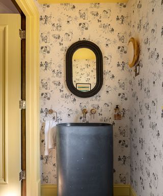 bathroom wallpaper with yellow painted trim woodwork and ceiling