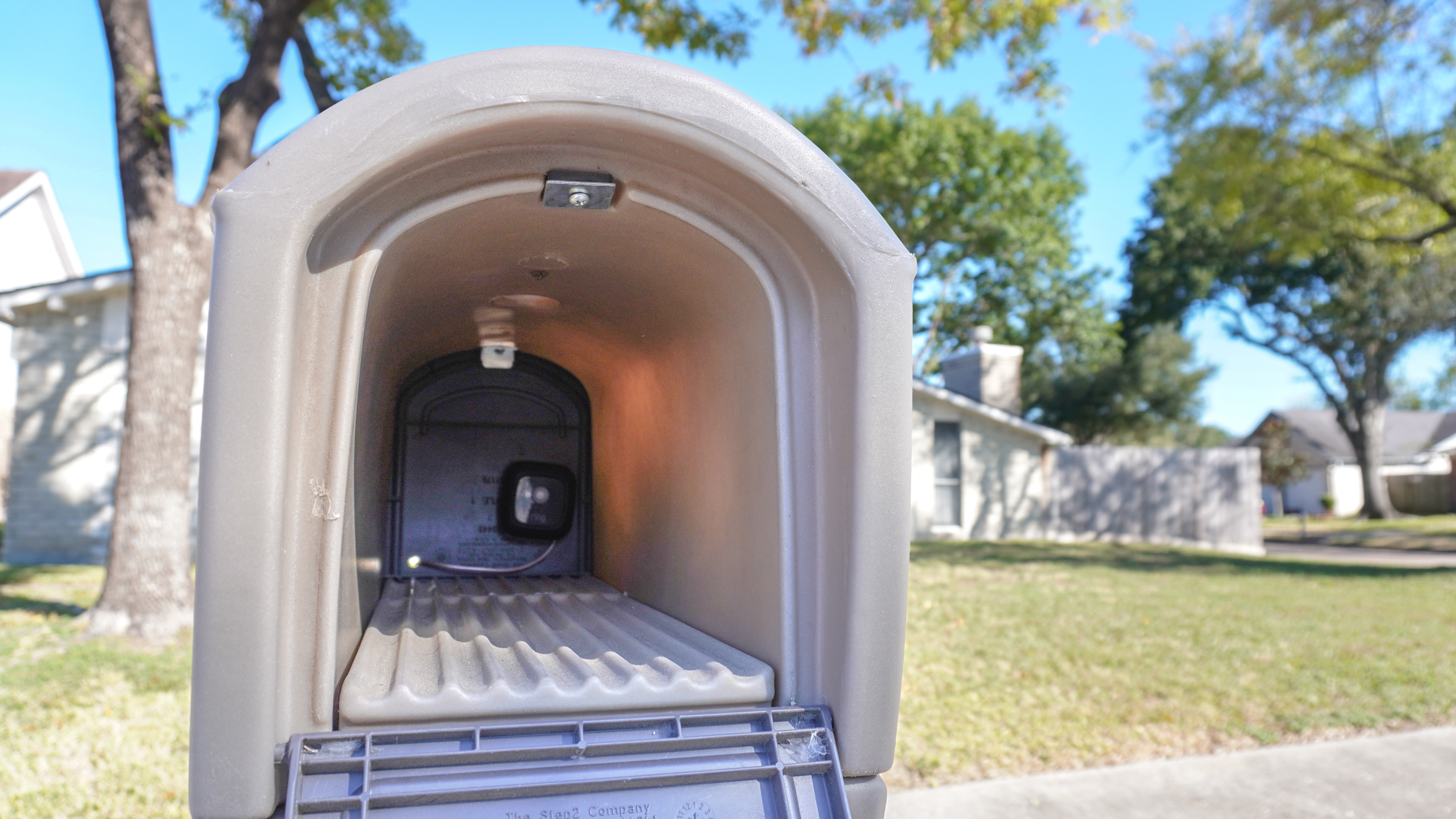 A Ring Mailbox Sensor installed at the back of a mailbox