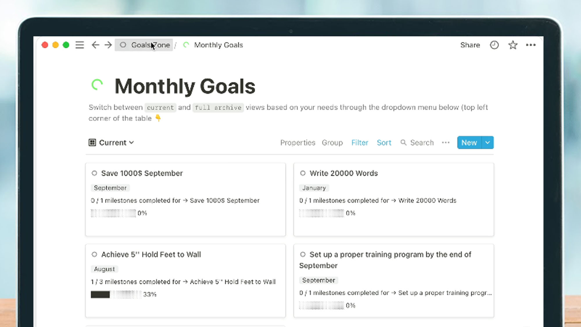 A laptop screen showing a monthly goals list in Notion