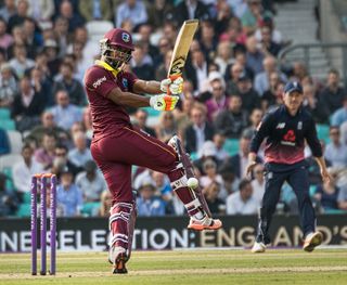 'Even Lewis pulls a four at The Oval' by Raymond Bridges. Winner of the Best Overall Projected Image in this year's Disabled Photographers' Society Awards