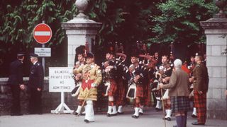Pipers Playing Their Bagpipes At The Gates Of Balmoral Castle.circa 1990s (Photo by Tim Graham Photo Library via Getty Images)