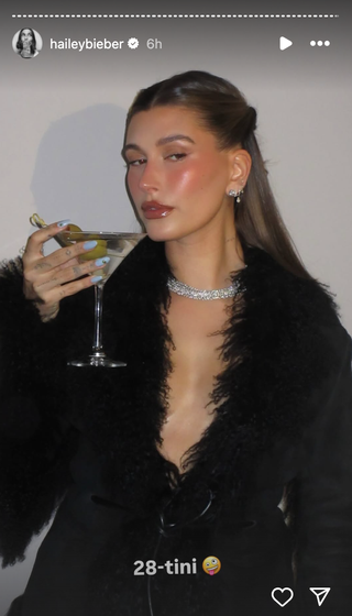 Hailey Bieber poses during her birthday celebration.