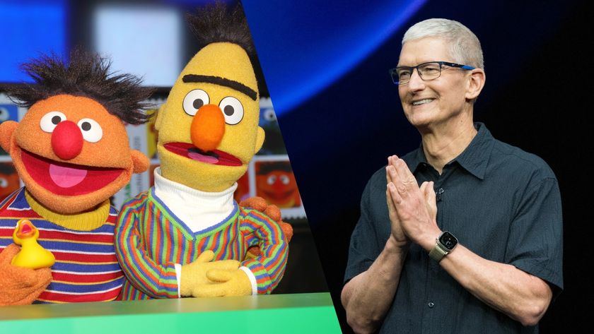 Ernie and Bert from Sesame Street next to Tim Cook