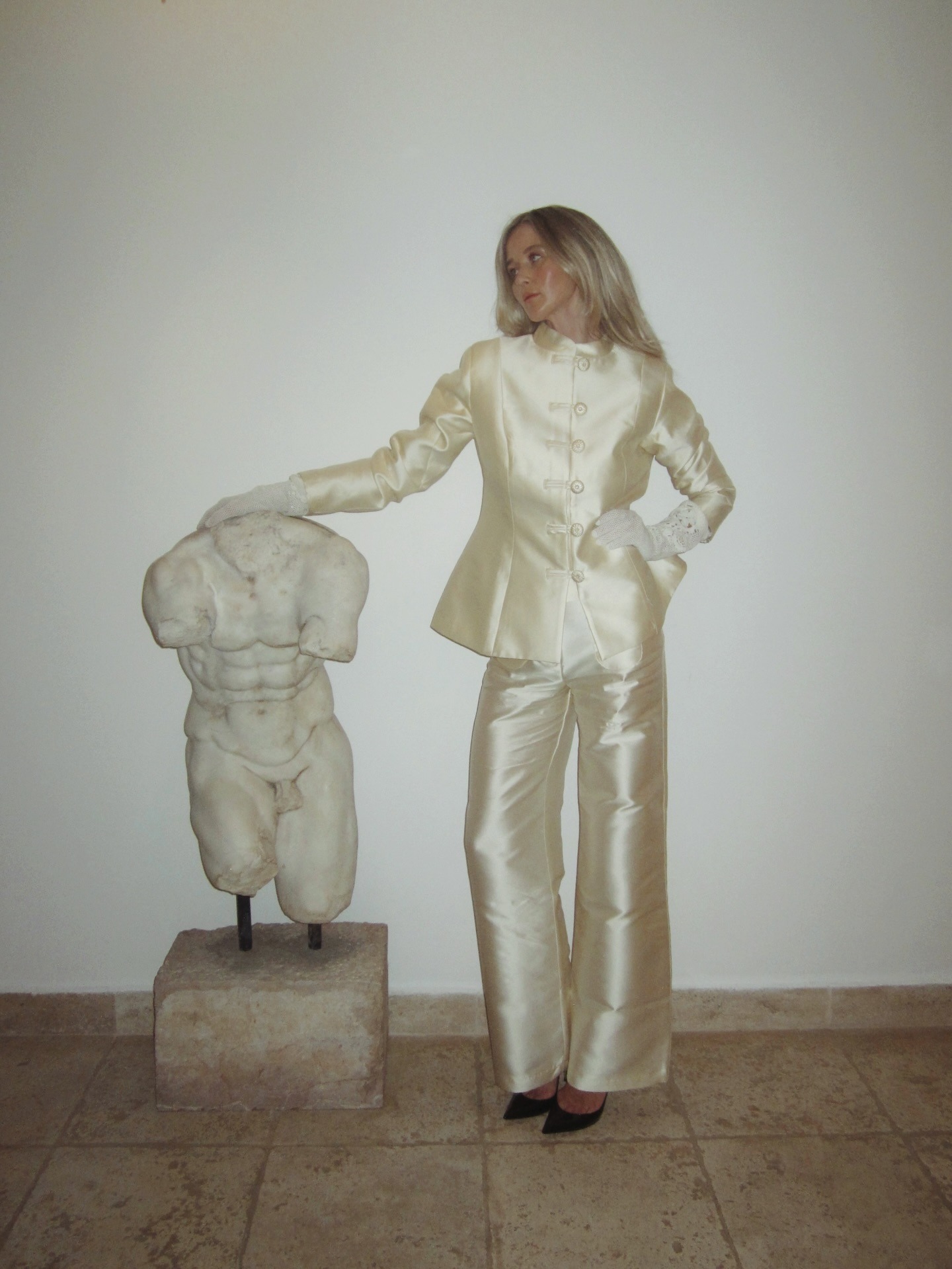 influencer @josefinehj wearing the frog closure jacket trend with satin pants and pumps