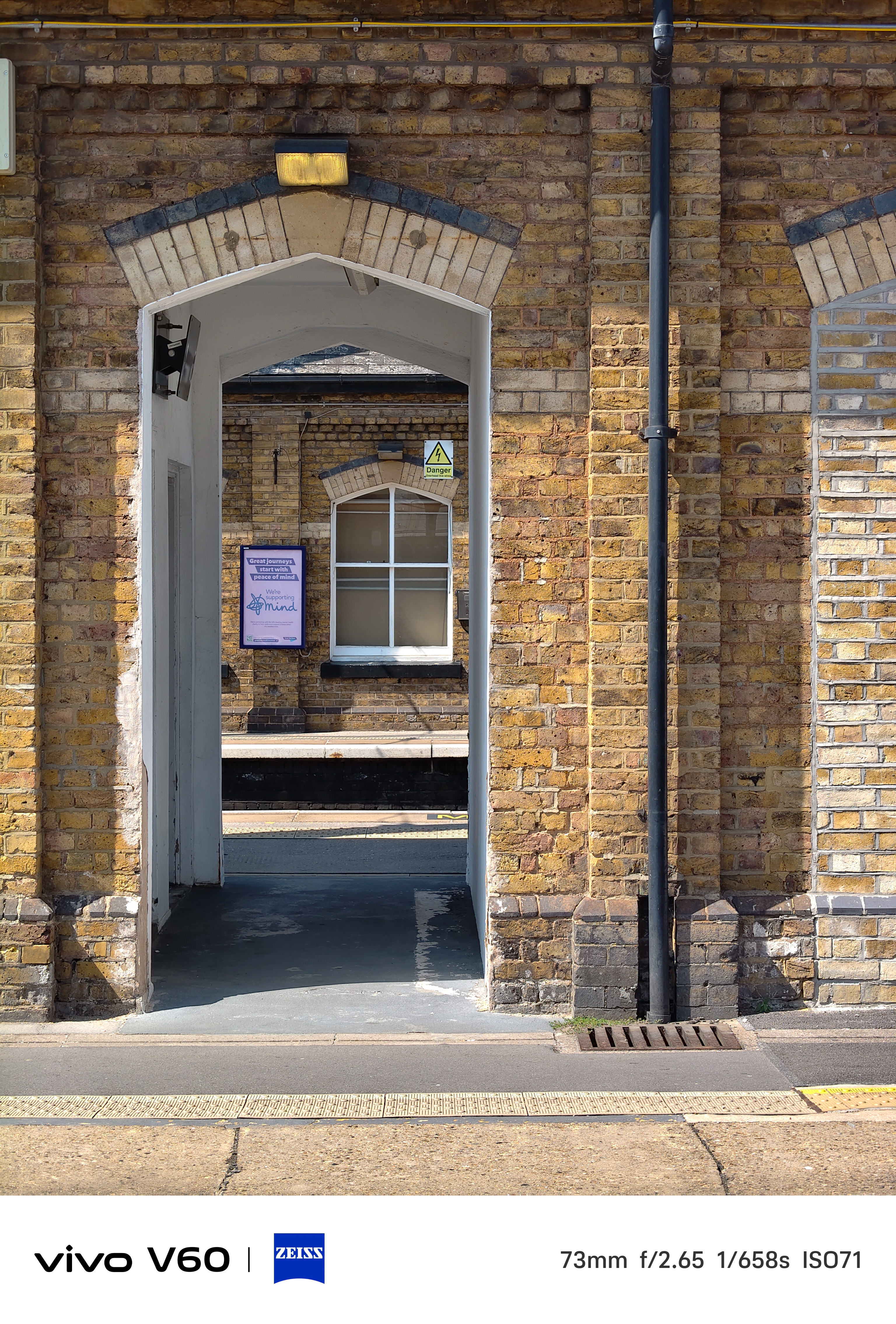 A passageway through a train station arch in London