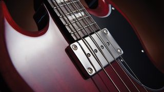 Close up of neck pickup on an Epiphone bass guitar