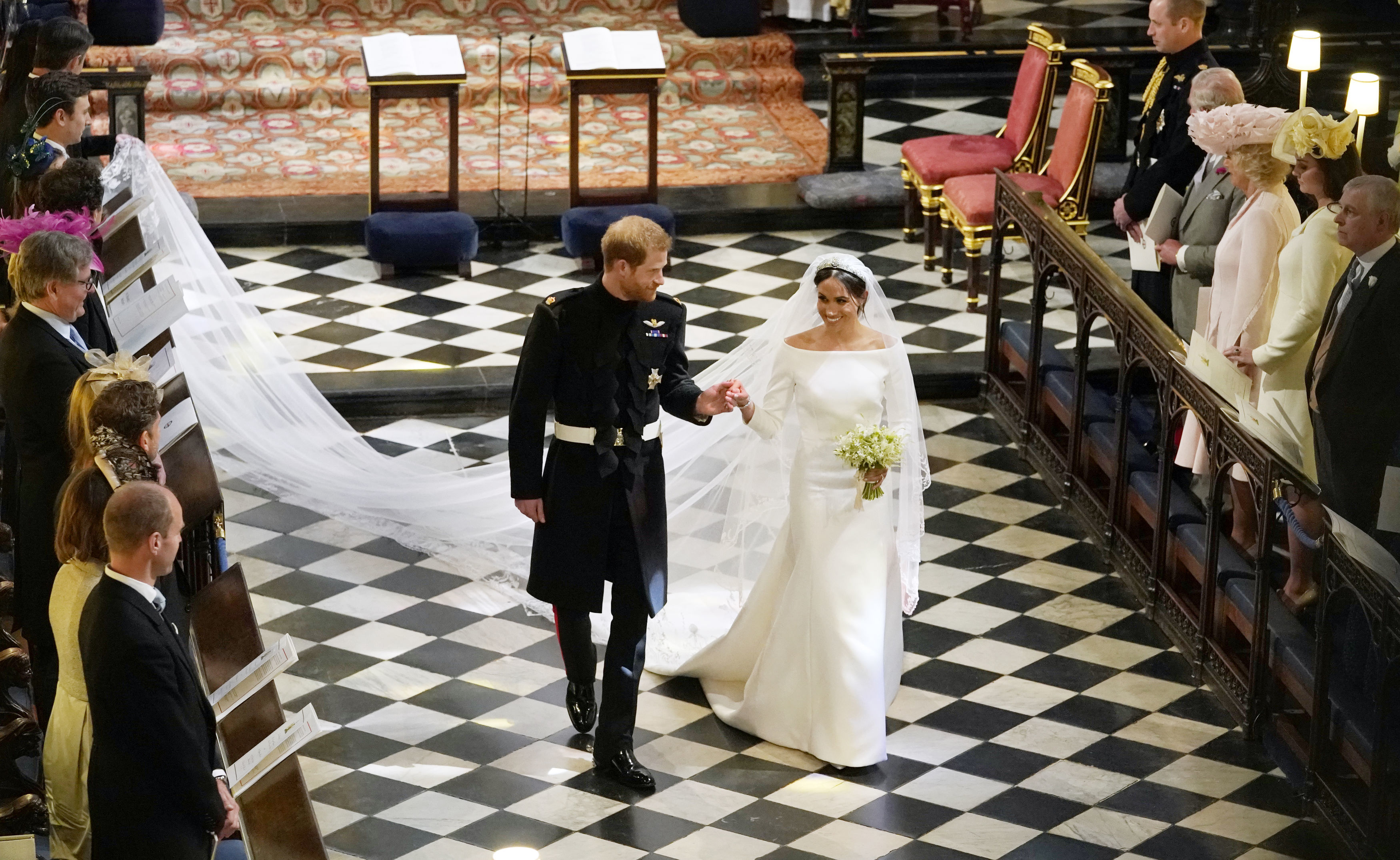 Meghan Markle walking down the aisle with Prince Harry on their wedding day
