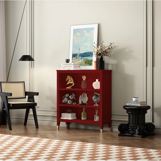 wooden red bookcase with gold feet