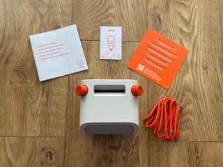 What's in the Yoto audio player box - the player, charging cable, Welcome Yoto card, and safety instructions