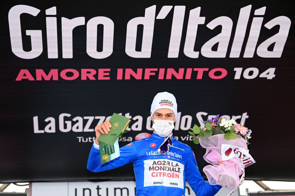 MONTE ZONCOLAN ITALY MAY 22 Geoffrey Bouchard of France and AG2R Citren Team Blue Mountain Jersey celebrates at podium during the 104th Giro dItalia 2021 Stage 14 a 205km stage from Cittadella to Monte Zoncolan 1730m UCIworldtour girodiitalia Giro on May 22 2021 in Monte Zoncolan Italy Photo by Stuart FranklinGetty Images