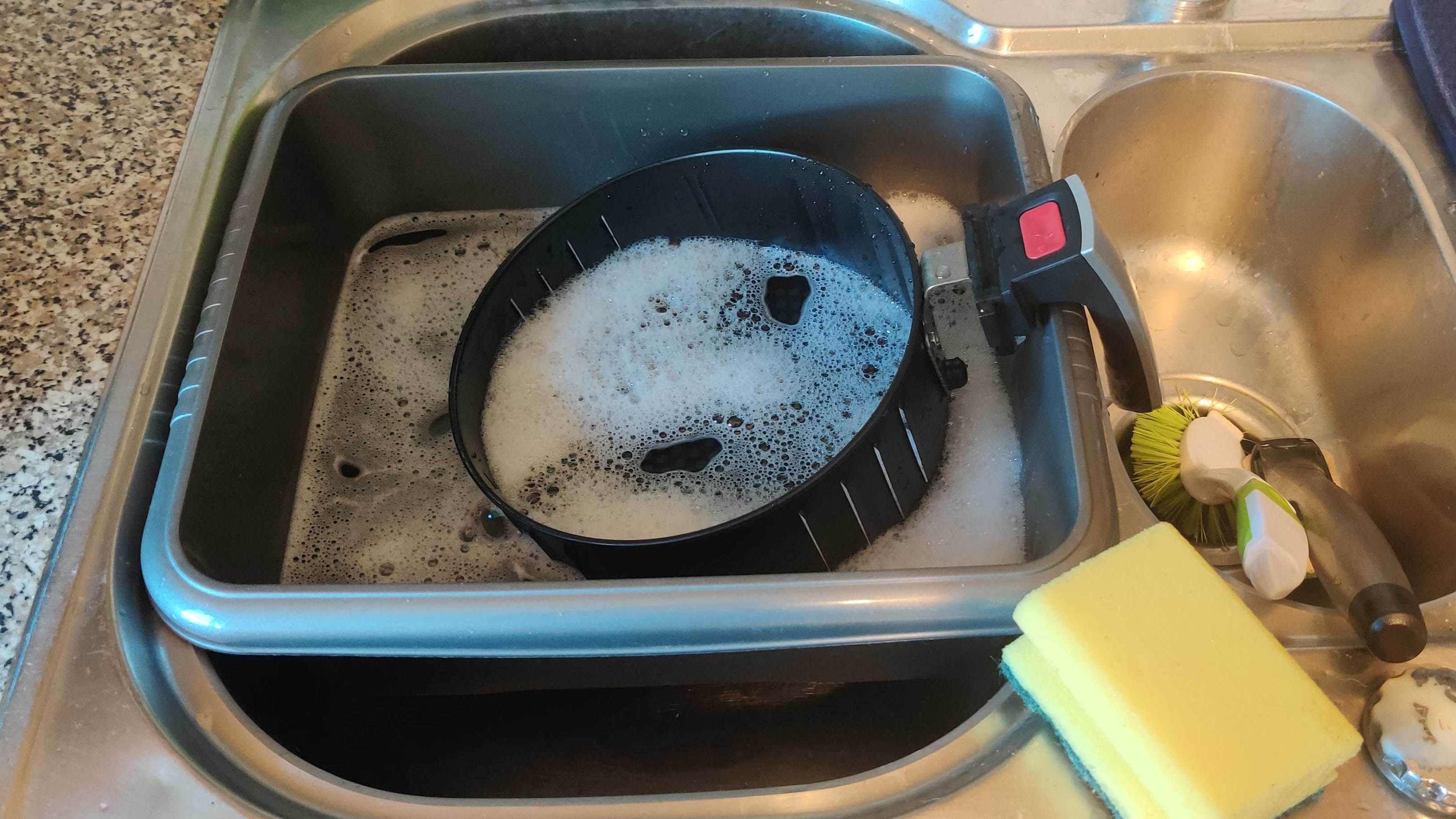 Air fryer basket being washed