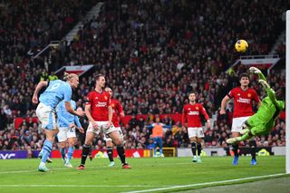 Andre Onana of Manchester United makes a save from Erling Haaland of Manchester City during the Premier League match between Manchester United and Manchester City at Old Trafford on October 29, 2023 in Manchester, England. (Photo by Michael Regan/Getty Images)