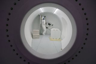 Looking through a porthole into the logistics and control module from inside Sierra Nevada Corp.'s Large Inflatable Fabric Environment, or LIFE, habitat, part of its Lunar Gateway ground prototype, at NASA's Johnson Space Center in Houston on Aug. 21, 2019.