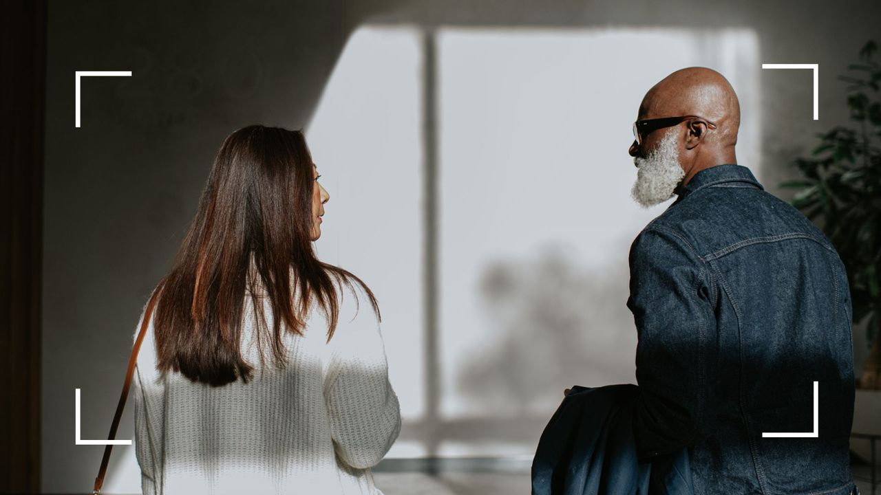 Woman and man walking away from each other, representing moving on from a relationship