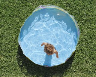 A child in a kiddie pool