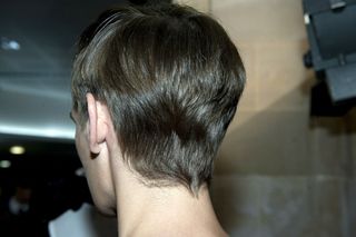 back of male models head with neat and styled hair