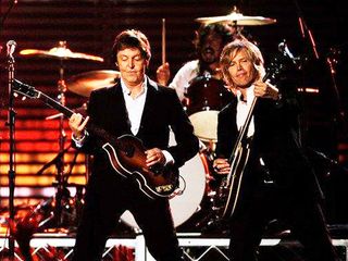 Brian Ray on stage with Paul McCartney at the 2009 Grammy Awards. (Check out Dave Grohl on drums!)