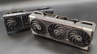 The Asus TUF Gaming RTX 5070 Ti OC Edition in front of the Asus Prime RX 9070 XT on a silver background