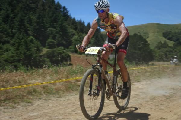 Otis Guy, former pro mountain bike racer, Mountain Bike Hall of Fame member and bike builder, blazes through the finish area.