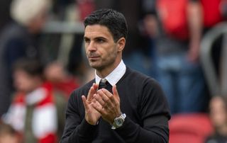 Arsenal manager Mikel Arteta applauds the fans at the final whistle during the Premier League match between Brentford FC and Arsenal FC at Brentford Community Stadium on September 18, 2022 in Brentford, United Kingdom.