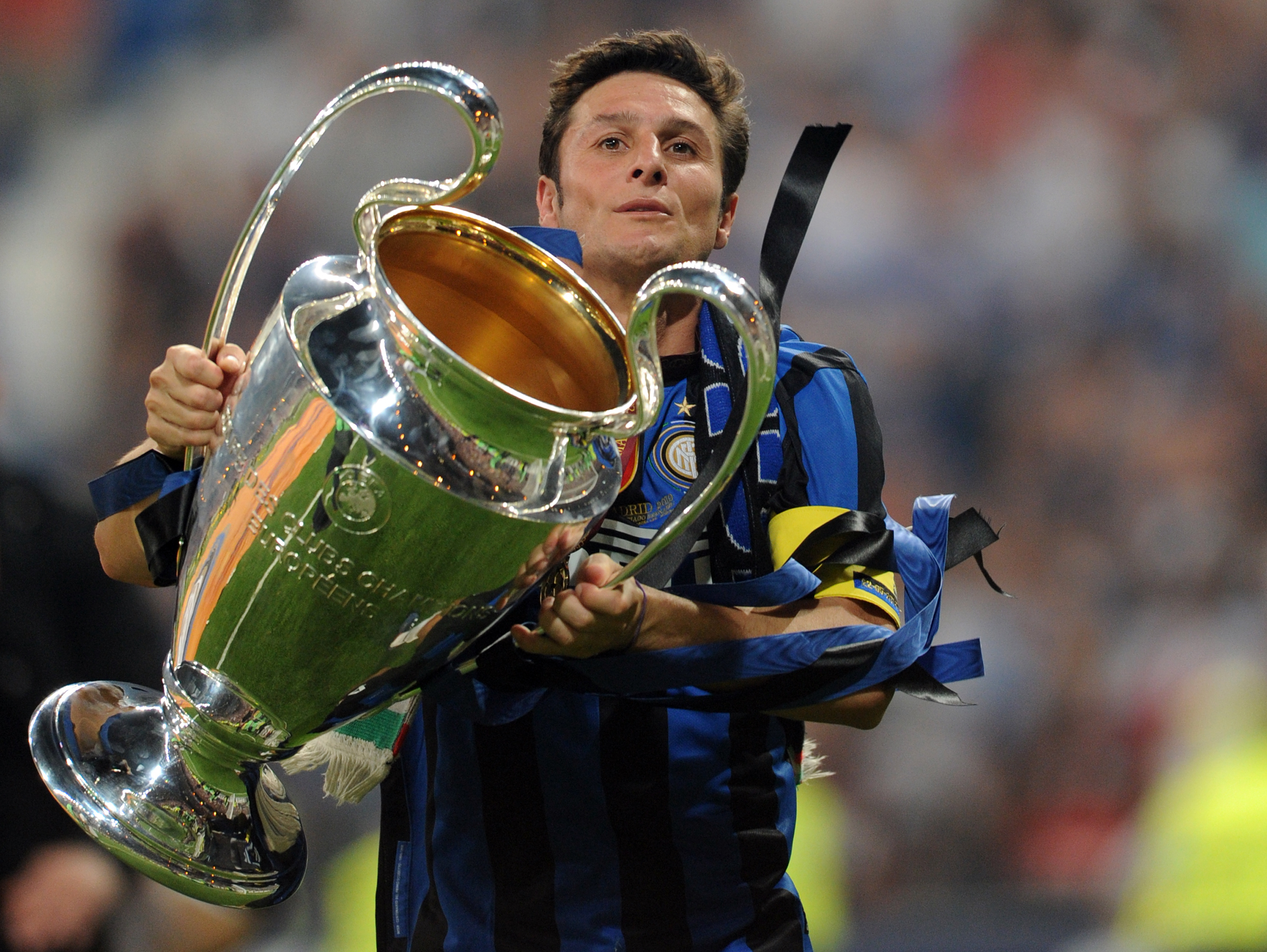 Javier Zanetti celebrates with the Champions League trophy after Inter's win over Bayern Munich in the 2010 final.