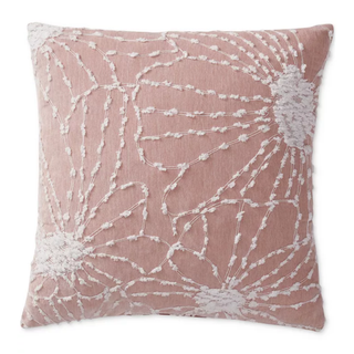 A pink and white embroidered chenille decorative pillow