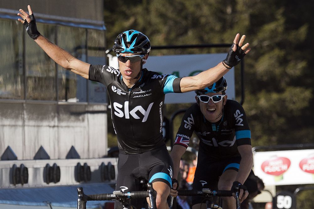 Richie Porte (L) celebrates as he crosses the finish line.
