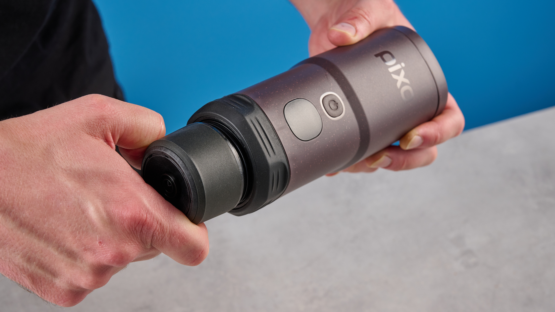 the wacaco pixapresso portable self-heating espresso maker in dark purple color showing usability with nespresso pods and ground coffee, ideal for vacations and camping