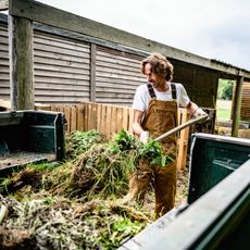 Man unloading composting greens and browns from truck