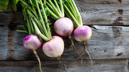 Purple turnips on a wooden table