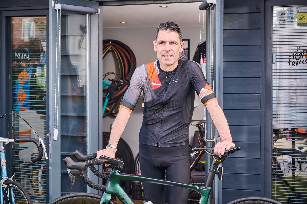 Close-up of David Rhead leaning on his bike