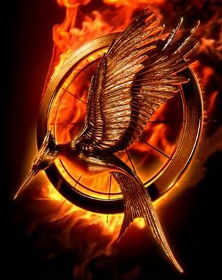 The motion poster shows the original Hunger Games logo transforming into the new design