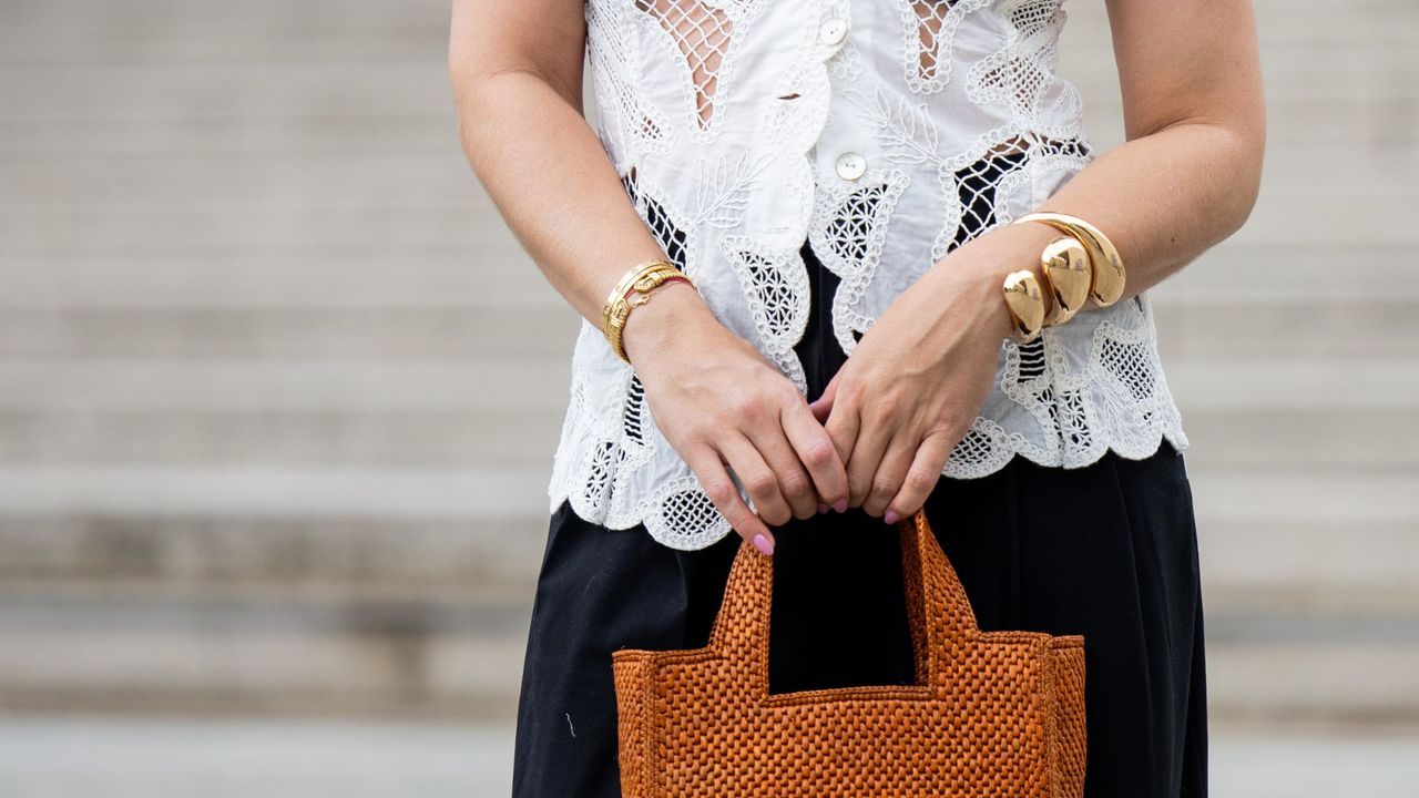 Rosewater Nails Sonia Lyson with orange bag and rosewater nails